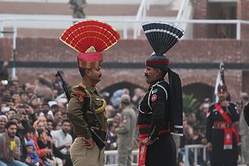 Beating retreat ceremony at Wagah Border of India-Pakistan. The two soldiers look at each other sternly to show aggression.